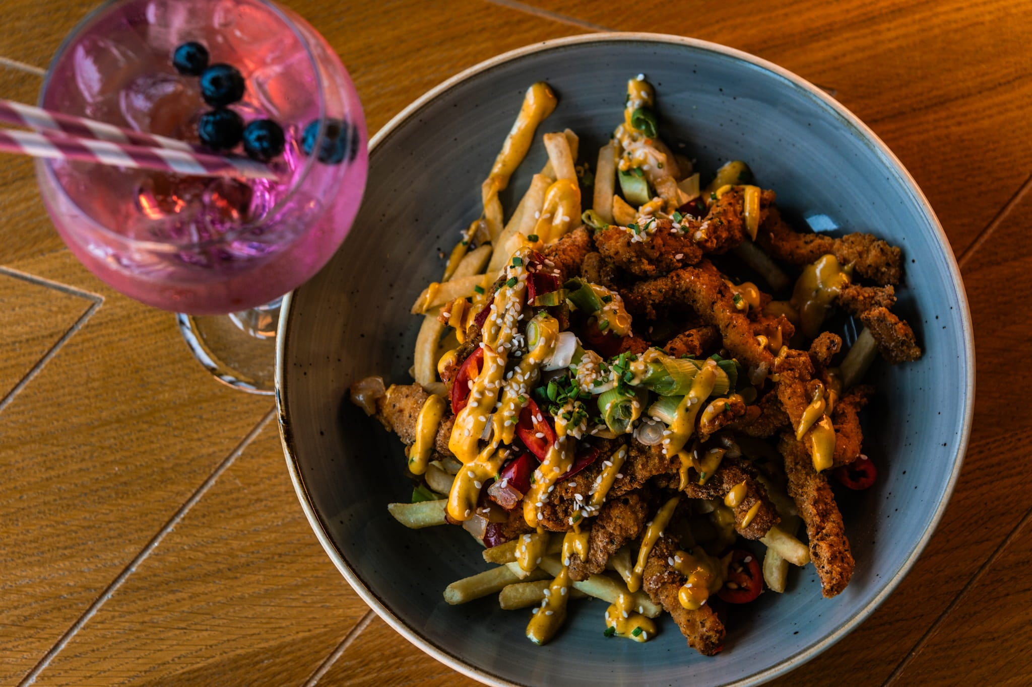 Chicken strip with a pink gin