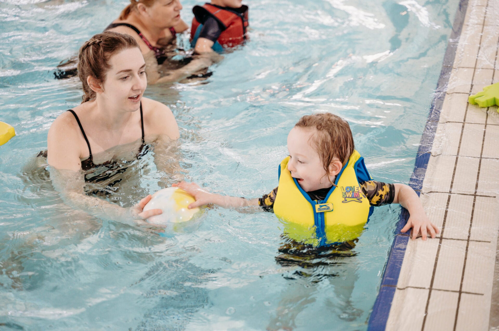 Mother and infant in the pool