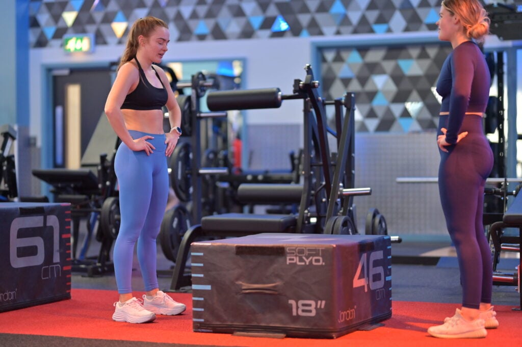 Two woman weight training