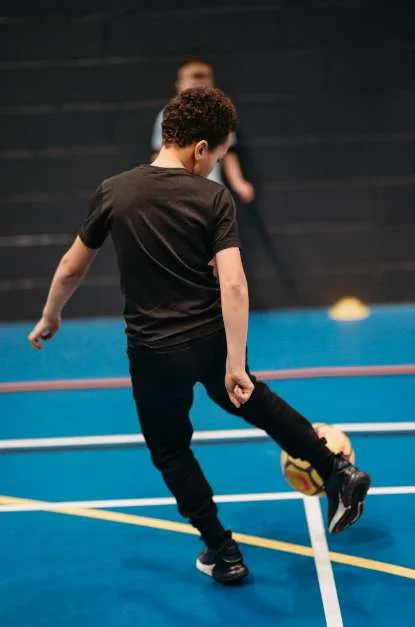 Boy kicking a football