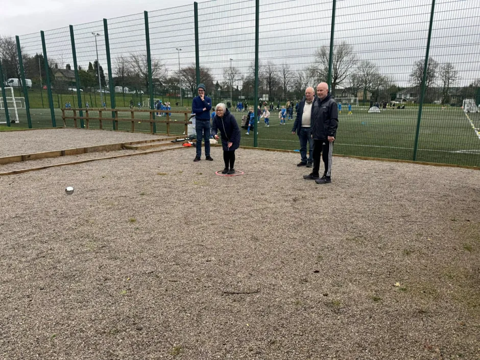 Community playing softball outside