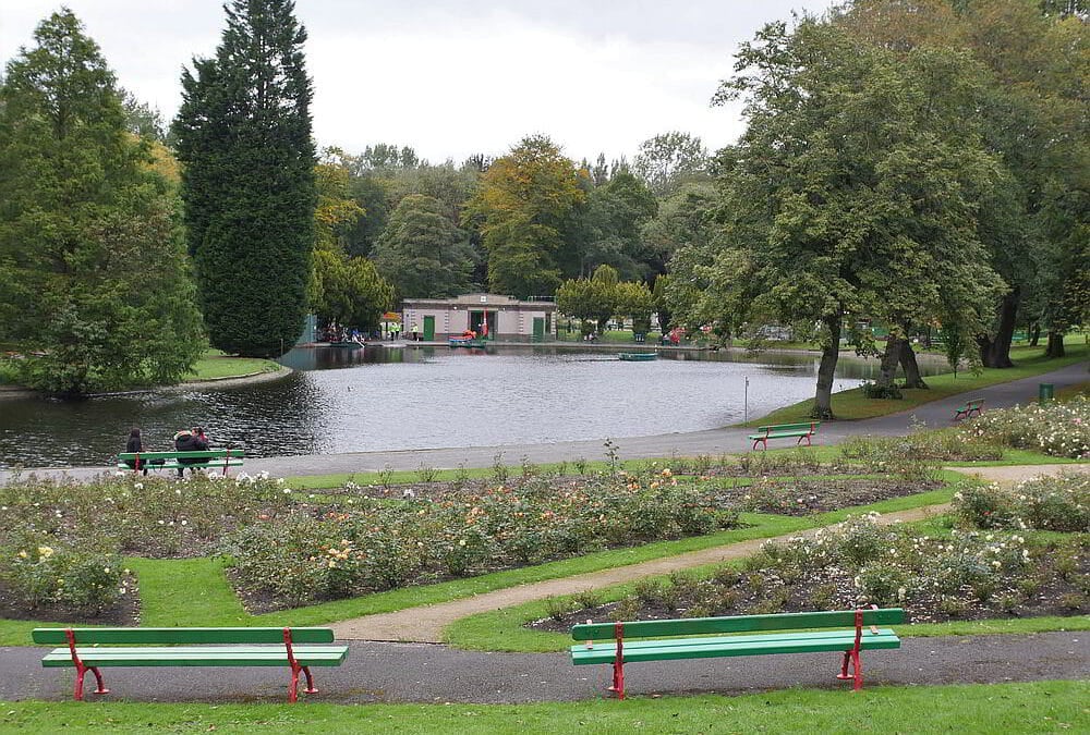 Park benches in front of Boathouse Lake