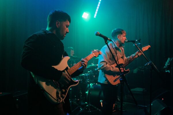 The Rafters paying guitar