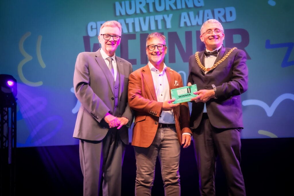 Nurturing Creativity Award winner on stage