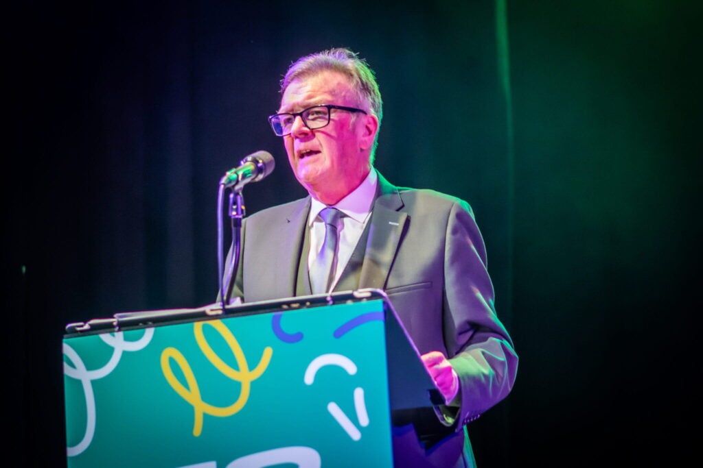 Renowned radio presenter John ‘Gilly’ Gillmore on stage presenting awards