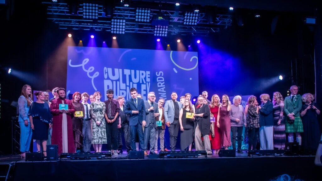 Group photo of all the Burnley award winners on stage