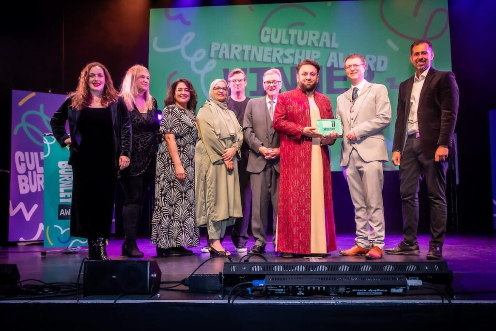 Cultural Partnership Award winers on stage