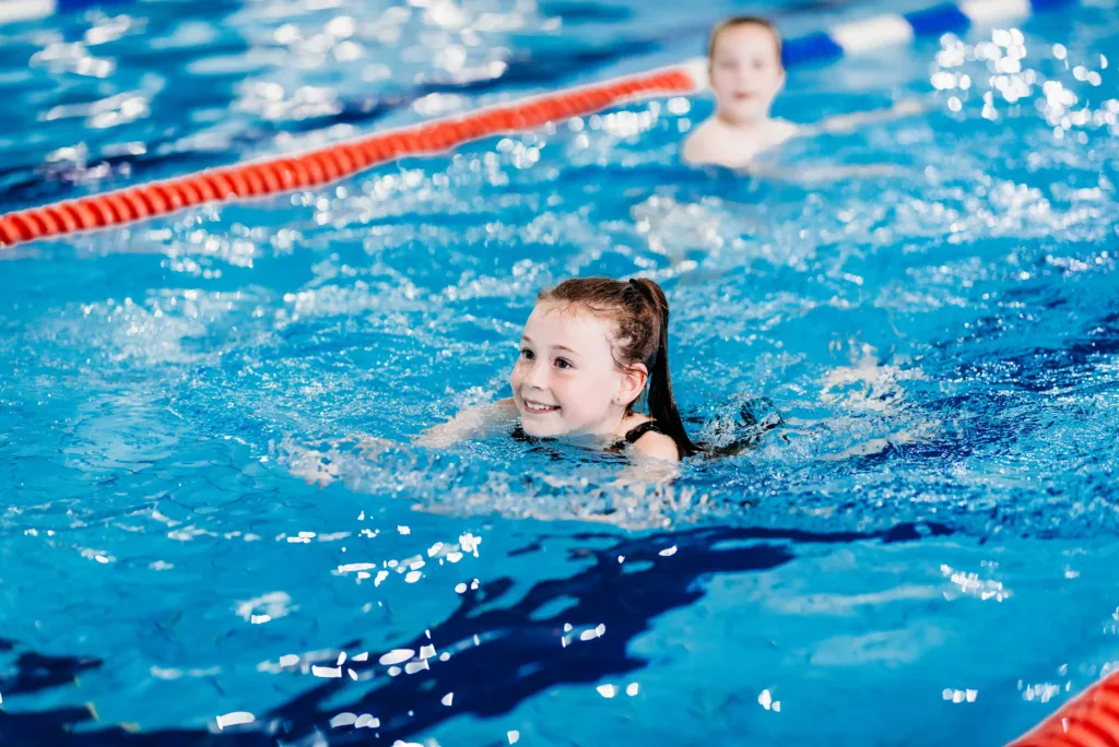 Child swimming a length in the pool