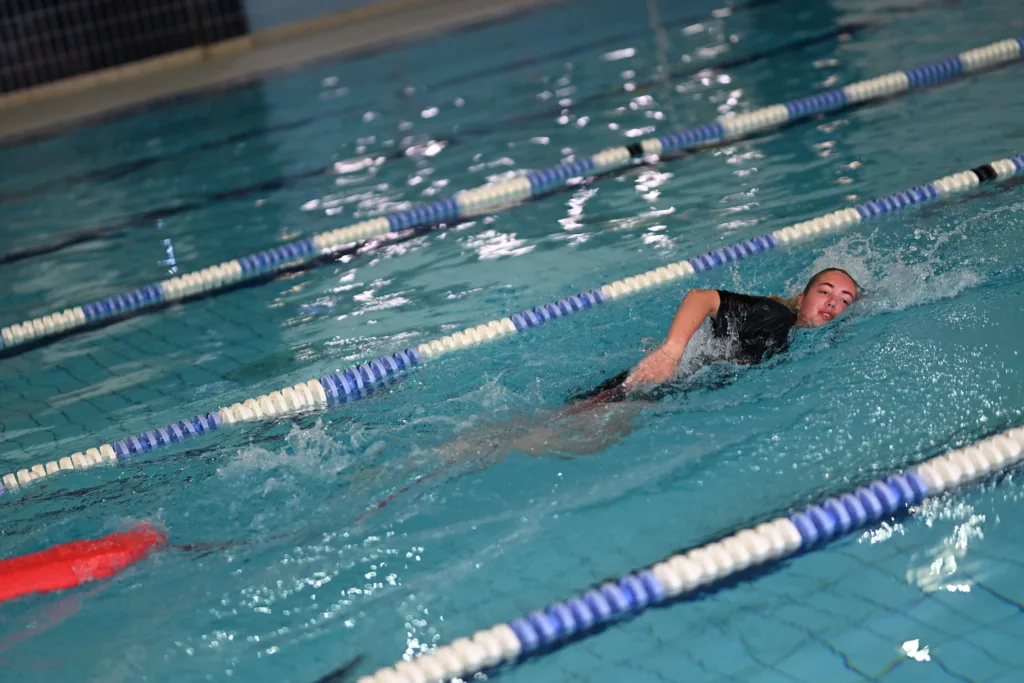 Young girl taking part in a stroke correction activity