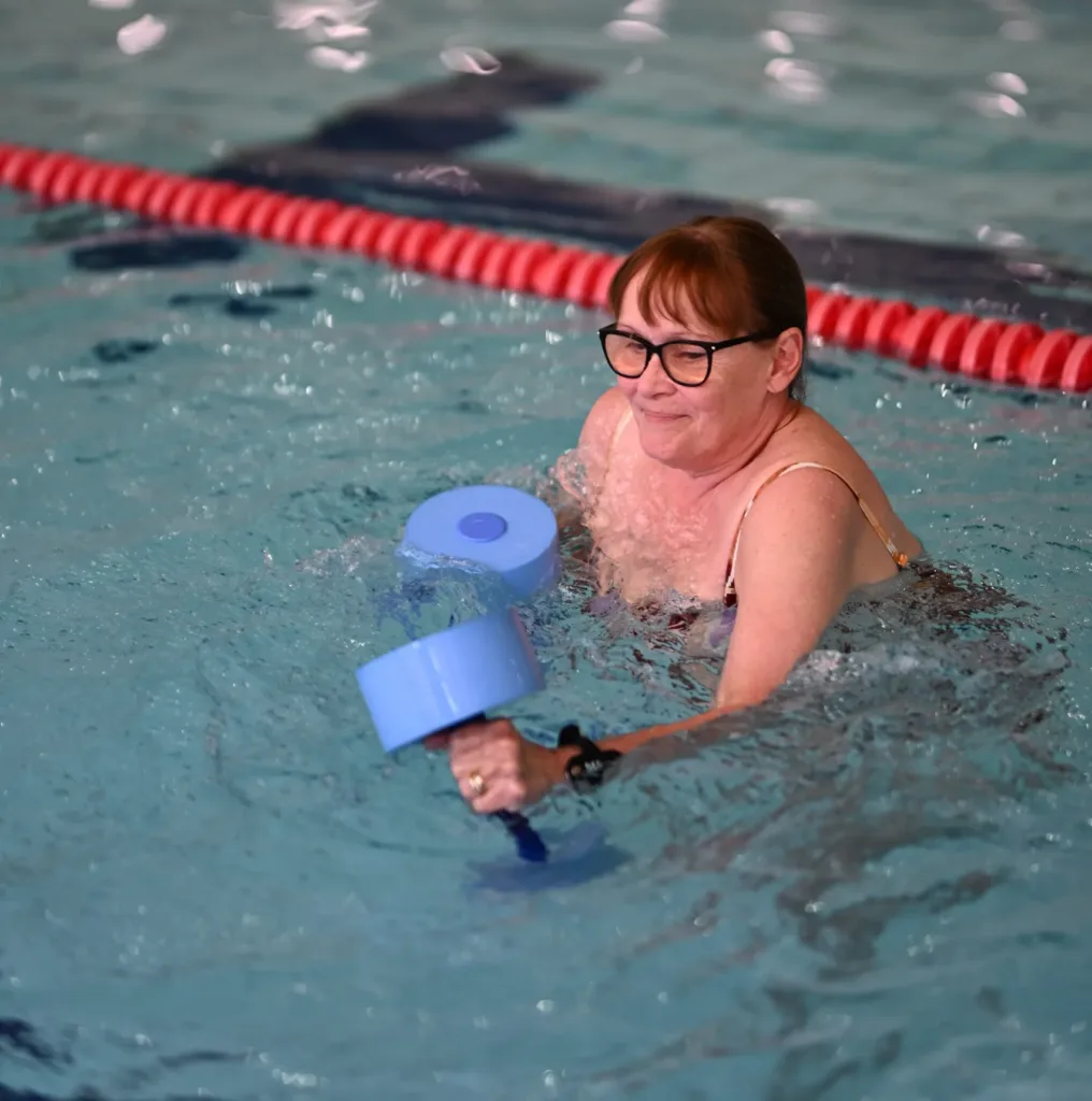 Lady taking part in a Water Wellbeing fitness class
