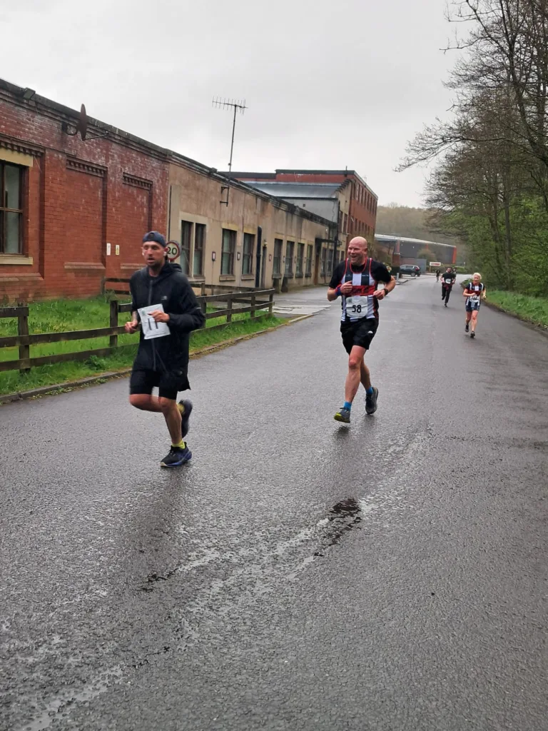 running race on the road, 4 people in the shot